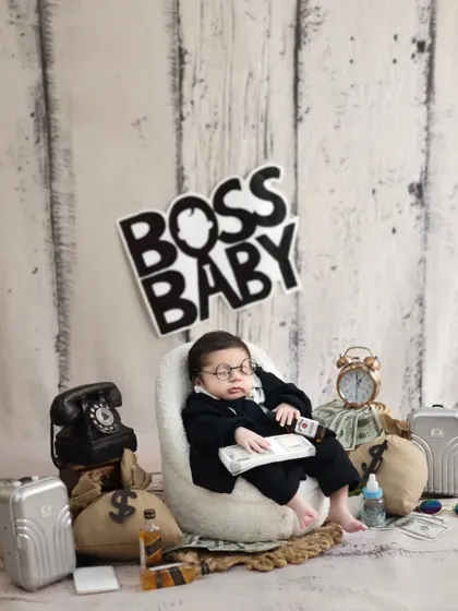 This sleeping Boss Baby is taking a break from his busy schedule. Even sleepy moments are cute moments, especially in a fun themed setup like this.