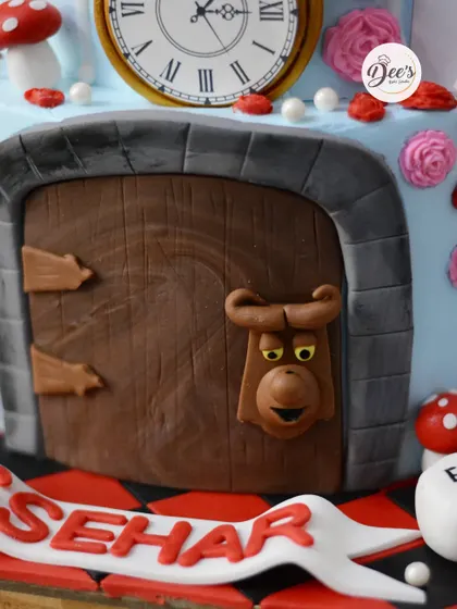 Down the rabbit hole we go with this Alice in Wonderland cake. This detailed cake features the talking doorknob and other iconic elements from the story.