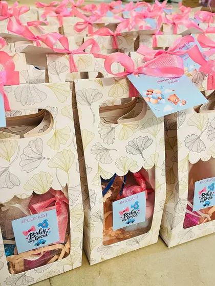 A collection of the "Pookash" baby shower favors, showing the consistent and cute packaging.
