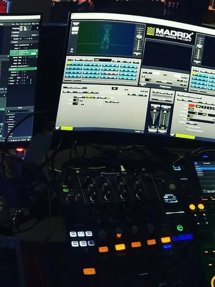 This is my command center. I'm not just playing tracks; I'm performing as a DJ and a VJ simultaneously. Using Pioneer DJ gear for the sound and Resolume with Madrix for the visuals, I create a complete sensory experience from the console.