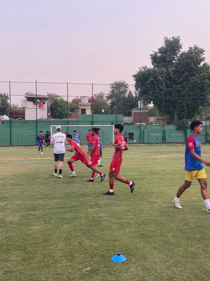 A training session on a grass pitch, showing the variety of facilities we use. Adapting to different surfaces is part of becoming a versatile player.