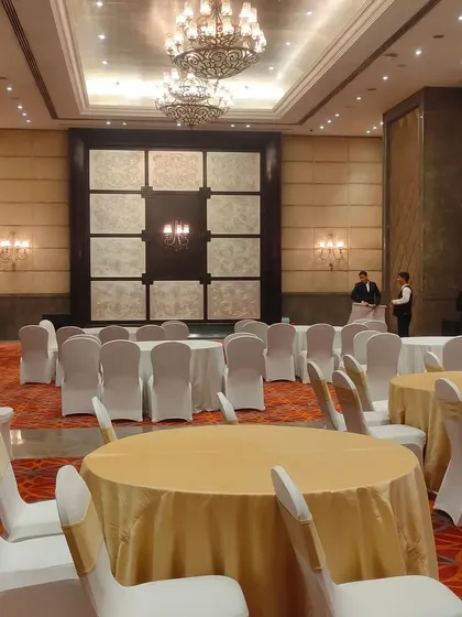 A view of the banquet hall before the guests arrive. I work with top venues to ensure the space is perfectly set up with elegant seating and table arrangements.