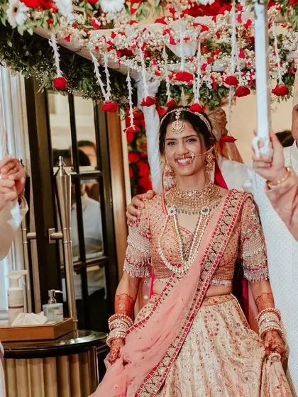The bride's entry is a moment for the whole family. Here, she is escorted by her father and brothers under a beautiful 'phoolon ki chaadar'.