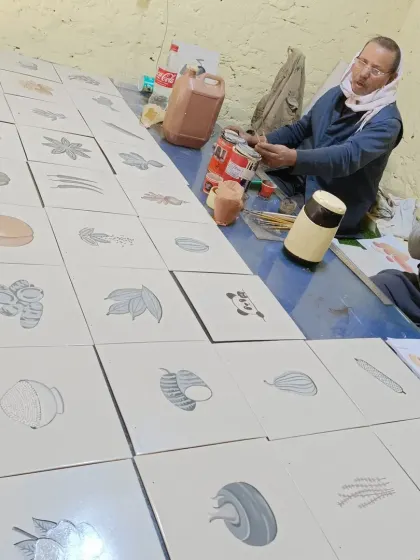 Me in my workshop, with a large series of botanical illustrations laid out on the table. This was part of a large commission for a client.