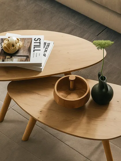 I believe in the beauty of simplicity, and this nested coffee table set embodies that philosophy. Crafted from light oak, the organic, curved shapes create a soft and minimal look. The two-tier design offers flexibility, allowing you to adapt the setup to your space and needs, making it a perfect centerpiece for a modern living room.