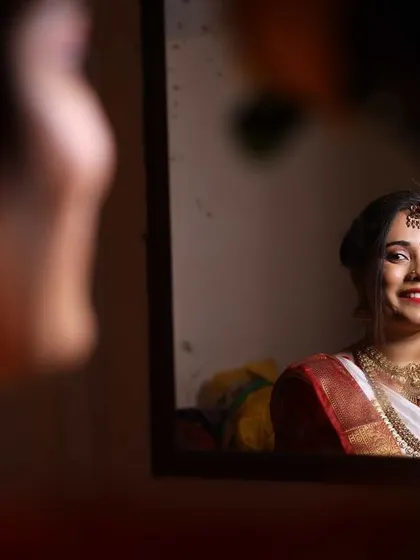 A quiet moment of reflection before the ceremony begins. Her makeup is designed to look flawless both in person and in photographs, capturing the essence of her bridal glow.