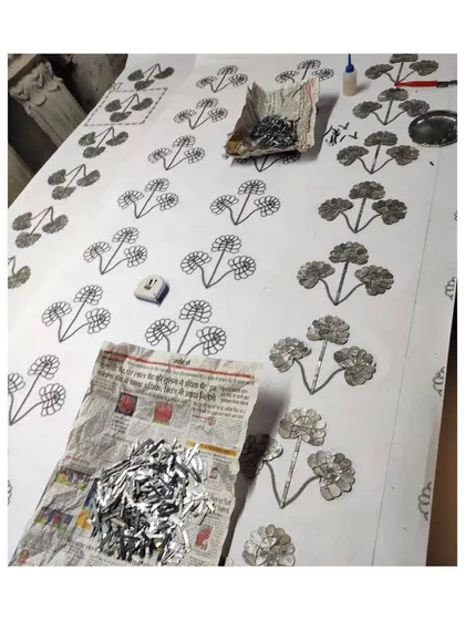 Another angle of the Thikri panel creation, showing multiple templates and the sheer quantity of glass pieces involved.
