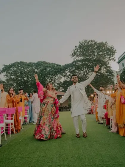 The grand entrance of the couple at their Haldi ceremony, greeted by cheering friends and family. We capture the energy and excitement of these key moments.