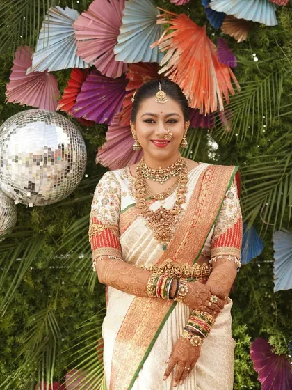 Draped in royalty, this bride embodies elegance and sophistication. Her look is timeless and graceful.