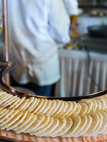 A beautiful arrangement of assorted crackers on a silver platter, part of our extensive grazing table spread. The focus is on quality ingredients and elegant presentation.