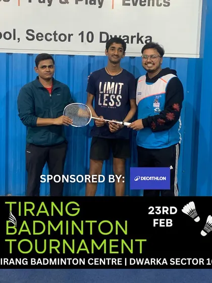 A "Limitless" t-shirt and a winner's prize. A participant from the Tirang Badminton Tournament, sponsored by Decathlon, showcases the spirit of our competitive events.