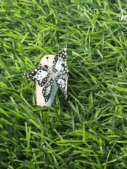 A closer look at the 5D butterfly. This technique allows for creating delicate, layered wings that look like they could fly right off the nail. It's a design that never fails to get noticed.