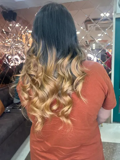A final shot of the blonde ombre, perfectly curled and full of volume. This is a look that is guaranteed to turn heads.