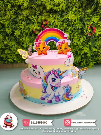 A cheerful two-tier unicorn cake with rainbows, stars, and butterflies. The bright pastel colours make it a happy and magical choice for a birthday party.