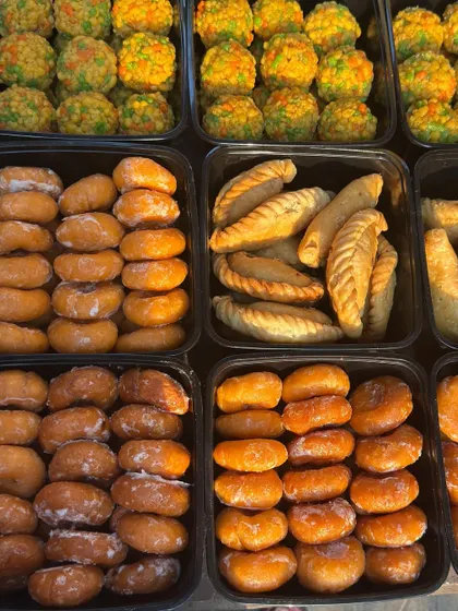 A glimpse of our colourful and delicious sweets prepared for Holi. I offer a wide variety, including traditional gujiyas, motichoor ladoos, and other treats, all packed fresh for your celebration.