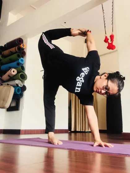 Happy World Vegan Day. A standing balancing stretch in my studio. My vegan lifestyle fuels my practice with clean energy and compassion.