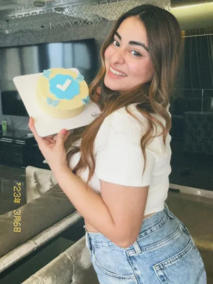The lovely MissMcBlush posing with her custom celebration cake.
