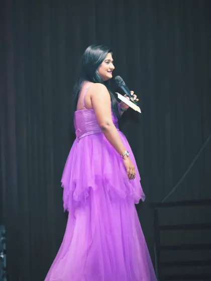 Just another day of lighting up the room in this lovely purple gown. The right color can make all the difference.
