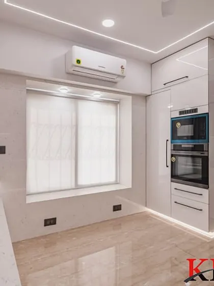 The corner of the U-shaped kitchen, showing the seamless cabinetry and the placement of the air conditioning unit.