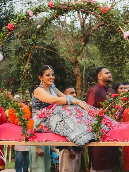 A bride's entry should be nothing short of royal. We designed this beautiful floral palanquin (doli) for Supreetha, allowing her to make a grand and graceful entrance, feeling like a true princess on her special day.