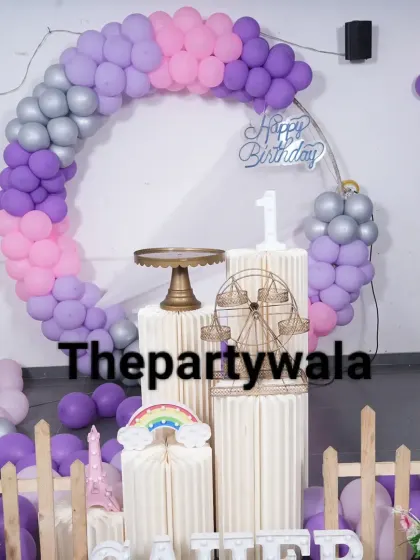 A purple, pink, and silver balloon ring, perfect for a simple yet beautiful birthday setup.