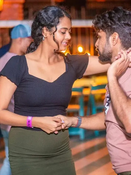 A sweet and connected moment between two dancers.