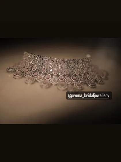 A product shot of a beautiful AD choker with pink stones, perfect for a reception or party.
