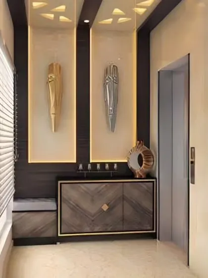 A duplicate of image 112, this foyer design showcases our ability to blend art, lighting, and custom furniture to create a truly unique and high-end entrance.