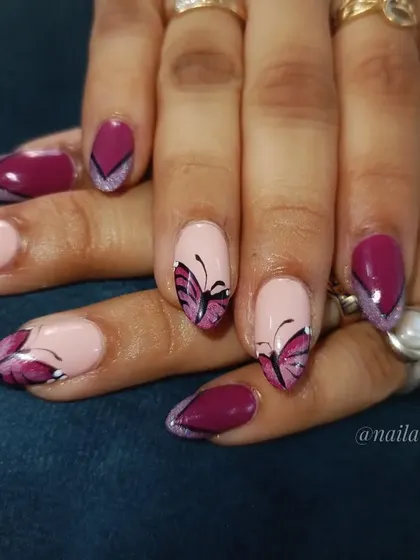 A butterfly-themed set, featuring hand-painted monarch butterflies and abstract wing patterns in a deep magenta.