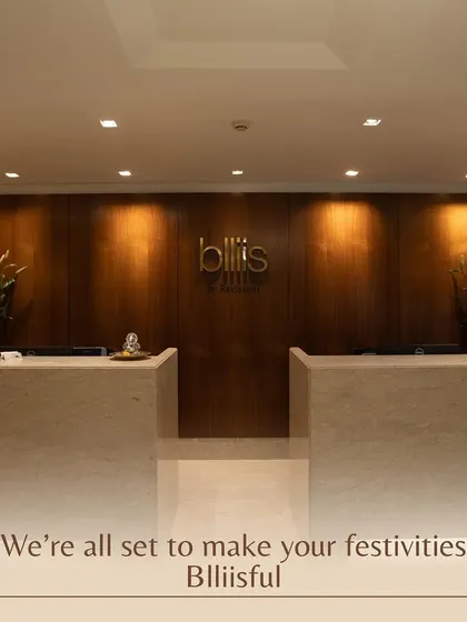 The reception at Blliis, where your journey to relaxation begins. The clean lines, warm wood, and elegant marble create an immediate impression of luxury and professionalism.