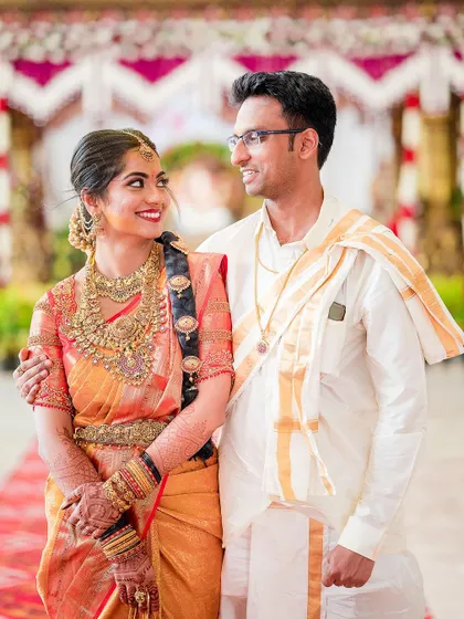 A beautiful portrait of the couple in their traditional South Indian wedding attire. The bride's adoring look at her groom is what makes this photo special.