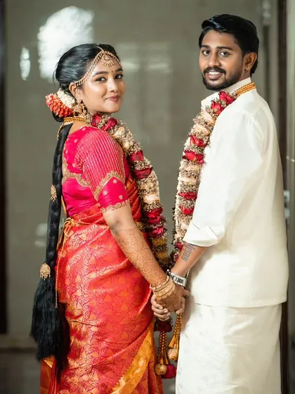 Looking back at the camera, this couple radiates happiness. The groom's styling is impeccable but doesn't overshadow his personality.