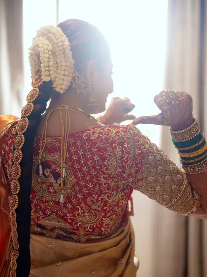 A back view of Sonal's bridal blouse, showcasing the detailed embroidery that covers the entire surface. Every element was designed to create a truly royal look.