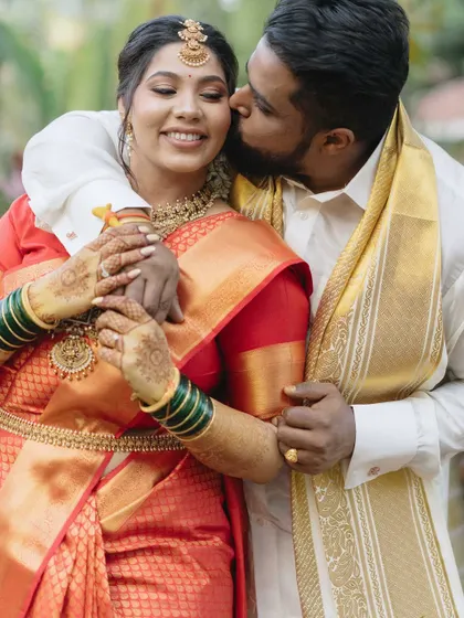 A gentle kiss and a happy smile. This close-up portrait of Gayatri and Akash is filled with the warmth and tenderness of their love story, which began with a chance encounter at the gym.