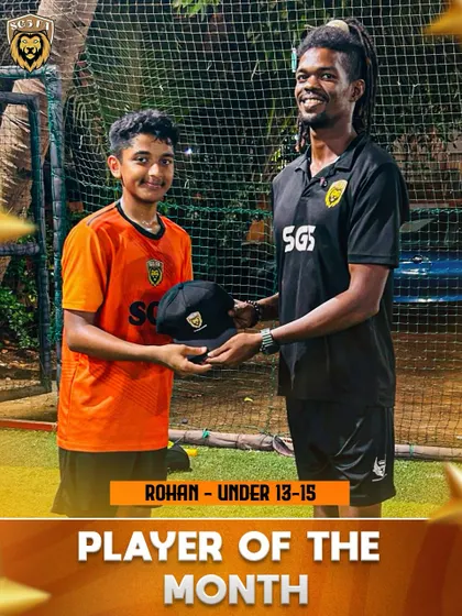 Rohan from the Under 13-15 batch receiving his Player of the Month award for his dedication and skill.
