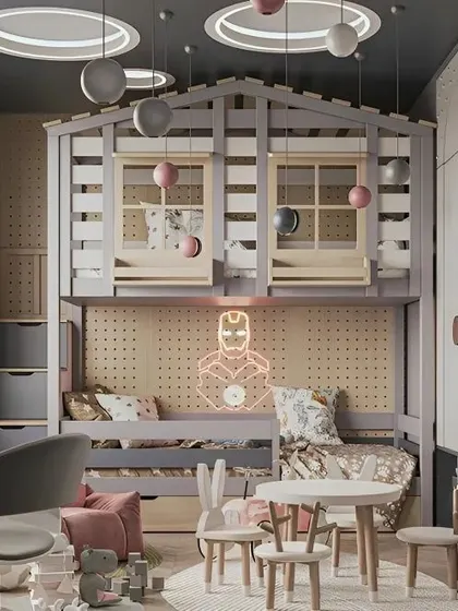 This superhero-themed room features a unique house-frame bunk bed, a small play table, and plenty of storage.