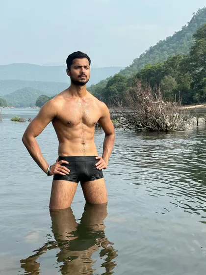 Another strong pose in the river, with the mountains in the background. This is ideal for adventure or swimwear brands.