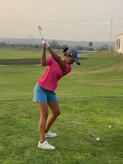 This player demonstrates great rotation and width at the top of her backswing.