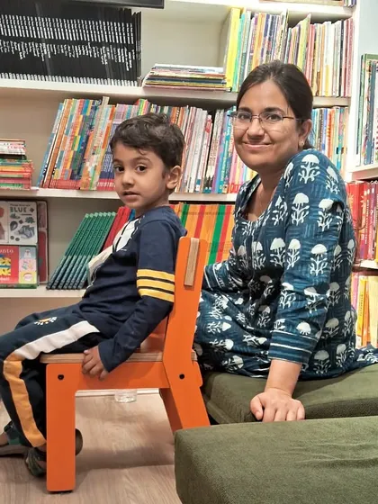 A quiet moment of connection between a mother and her son. Our store is a welcoming space for families to relax.
