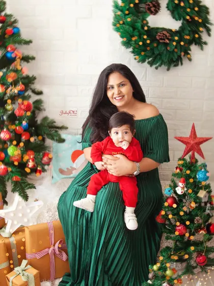A beautiful mother and son portrait from our Christmas mini-sessions. The festive background adds a touch of holiday magic to this sweet family moment.