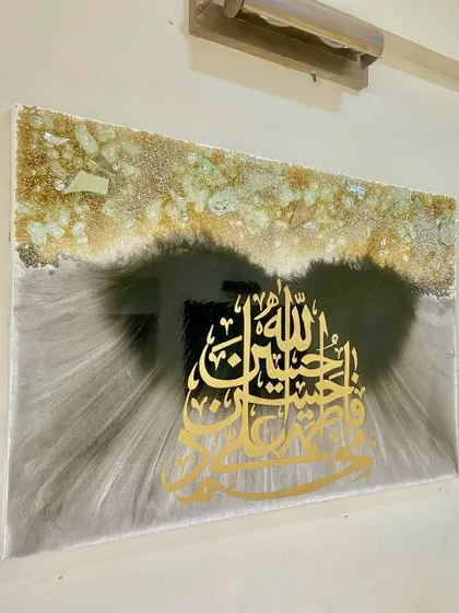 Another angle of the Panjatan Pak artwork, showing how the light interacts with the metallic grey strokes and the glossy resin surface.