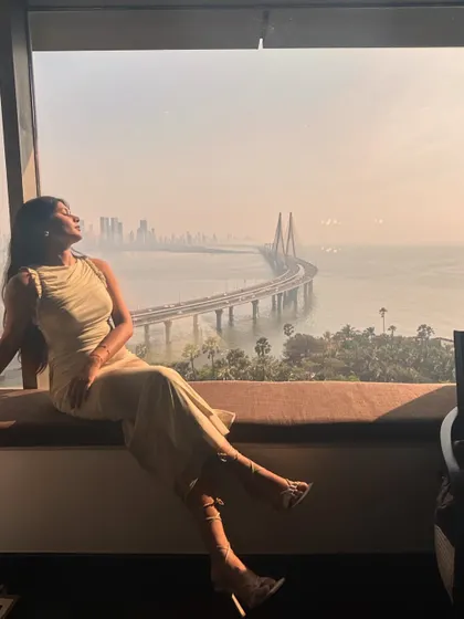 Soaking in the Mumbai view before heading to the 'Next on Netflix' event. The soft, neutral tone of the dress looked beautiful in the golden hour light.