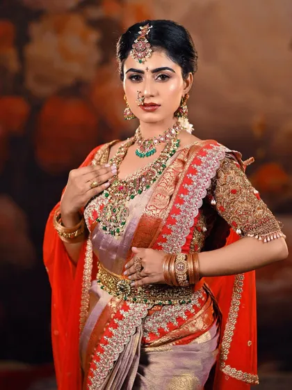 This shot offers a closer look at the layers of necklaces, from the choker to the long haram, that are central to a traditional South Indian bridal look.