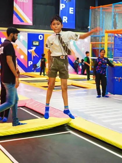 A scout in his uniform enjoying the trampolines. I welcome all kinds of student groups for a day of active fun.