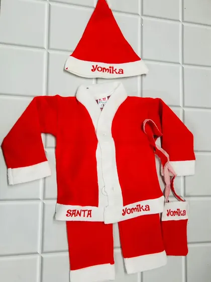 A complete Santa Claus costume for kids, which can be personalized with their name on the hat, belt, and stocking.