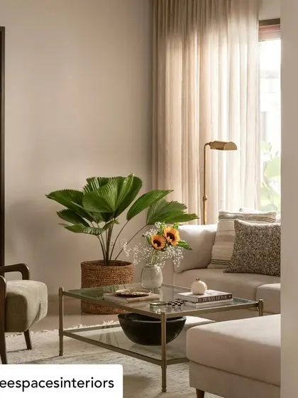 A detail shot from the Elle Decor featured home, showing our glass and metal coffee table. This piece adds a sense of lightness and modern elegance to the relaxed, Californian-hacienda-inspired living room.