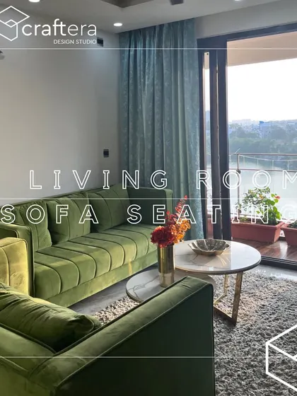 This living room is designed for relaxation, with a comfortable green sofa overlooking a balcony. The space is perfect for unwinding and enjoying the view, blending indoor comfort with outdoor scenery.