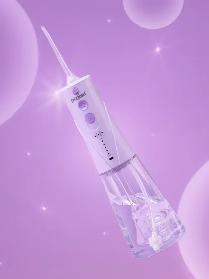 A dreamy, conceptual shot for Perfora's water flosser. The floating bubbles and purple monochromatic color scheme create a magical and high-tech feel.