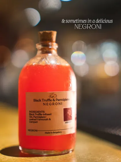 Our Black Truffle & Parmigiano Negroni, a savory and sophisticated take on the classic. This bottled cocktail features black truffle-infused gin and parmigiano-washed vermouth, demonstrating our expertise in flavor infusion and advanced mixology.