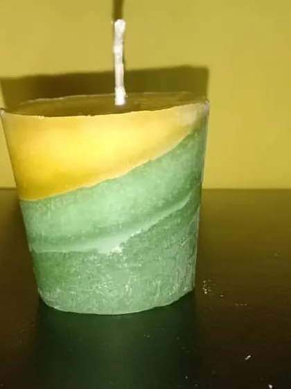 A single layered candle with a swirling green and yellow pattern. This shows the artistic freedom I have with handmade production, creating truly one-of-a-kind pieces.